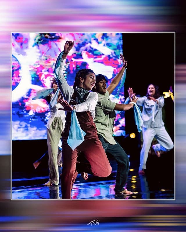 An NDDL dancer caught midair during a high-energy performance
